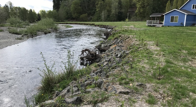 A house next to a river bank in the Chehalis Basin.